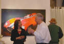 Gallery Event Photos - Gallery Framer Craig Salathe telling The Ferrari Girl about his own Ferrari