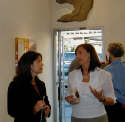 Gallery Event Photos - Sept 2005-Collector Susanne Turnipseed discusses a commissioned painting with Holly Martz
